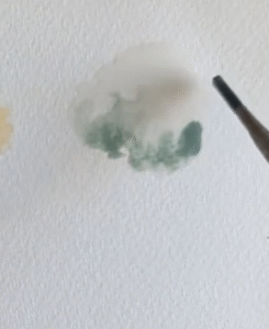 Wet paint moving in water, showing the wet-on-wet technique